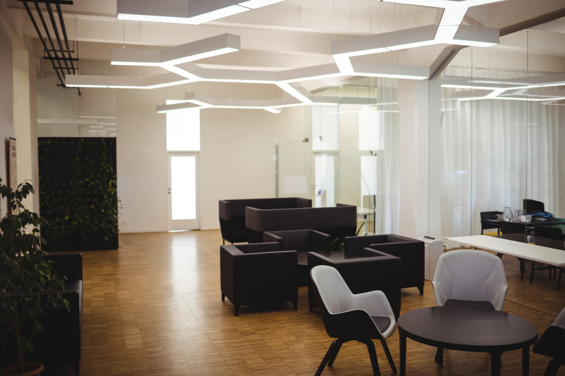 View of empty modern office with sofa, table, chair